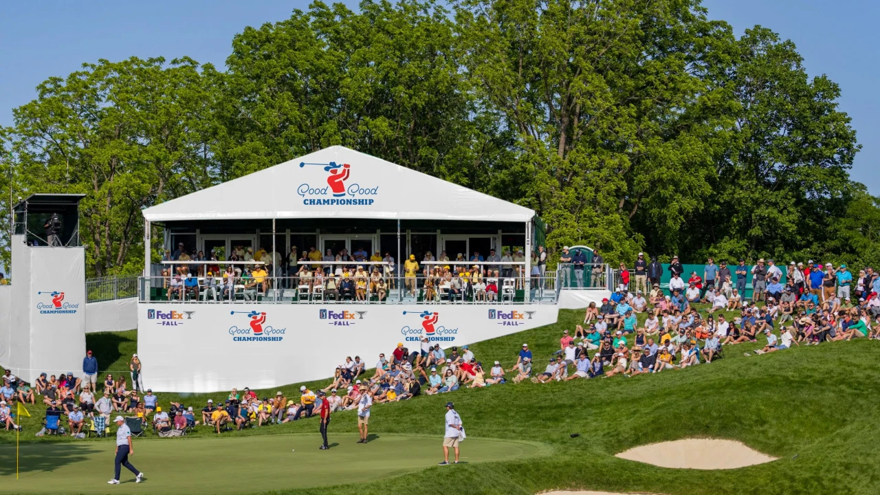 Fans watching golfers on the green beside a hospitality tent at the Good Good Championship in Texas.